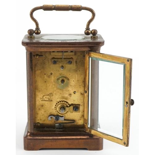 231 - French brass cased carriage clock with enamelled dial having Roman numerals and travel case, 11cm hi... 