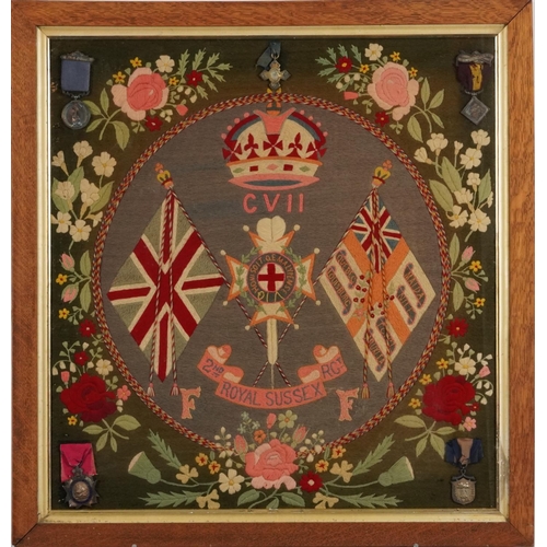 494 - British military Royal Sussex Regiment tapestry with Army Temperance medals, mounted, framed and gla... 