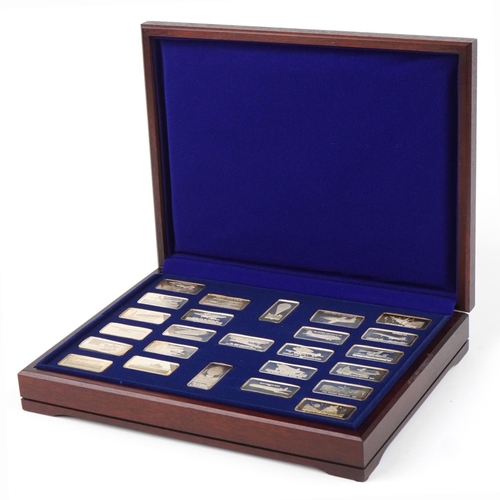 The Milestones of Manned Flight, twenty five solid silver ingots by The Birmingham Mint housed in a velvet lined fitted mahogany case, each 31g, total approximately 775g, the case 35.5cm wide