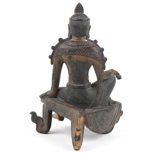 1126 - Chinese partially gilt and red lacquered patinated bronze figure of Buddha, 25cm high