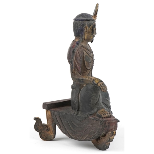 1126 - Chinese partially gilt and red lacquered patinated bronze figure of Buddha, 25cm high