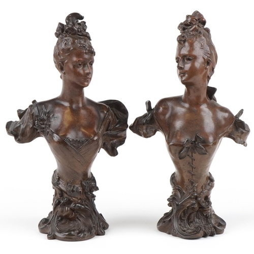 30 - Pair of Art Nouveau patinated spelter busts of scantily dressed females with C scroll decoration, ea... 