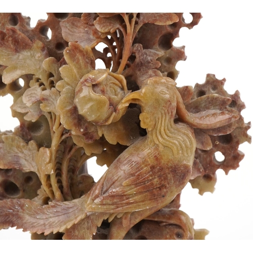 1148 - Chinese soapstone carving of a phoenix amongst flowers, 24cm high