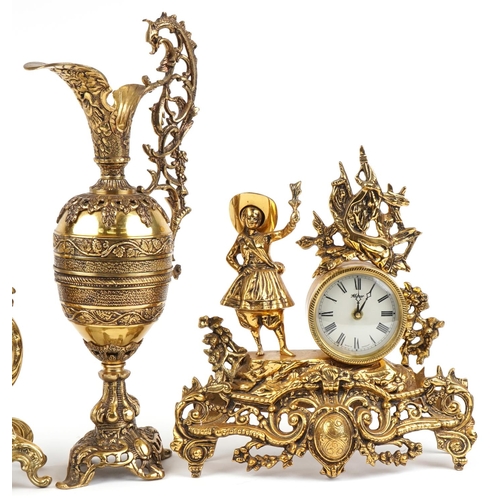 1087 - Two French Rococo style mantle clocks and a large brass ewer with C scroll decoration, the largest 5... 