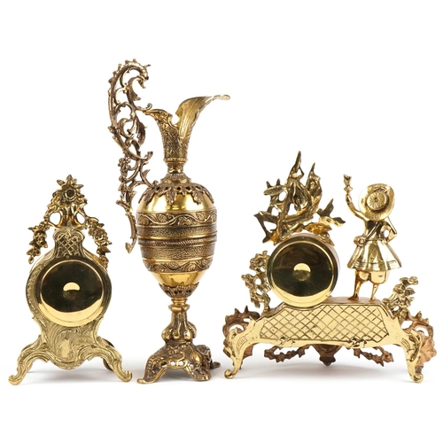 1087 - Two French Rococo style mantle clocks and a large brass ewer with C scroll decoration, the largest 5... 