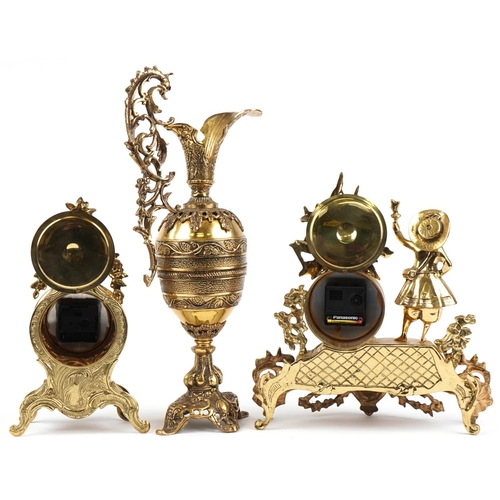 1087 - Two French Rococo style mantle clocks and a large brass ewer with C scroll decoration, the largest 5... 