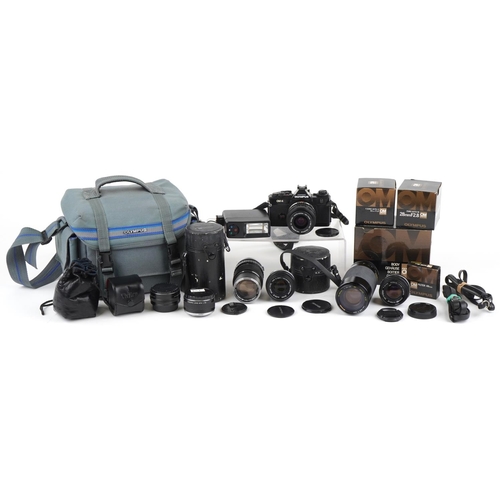 1338 - Canon OM-4 camera with various lenses and accessories, some with boxes