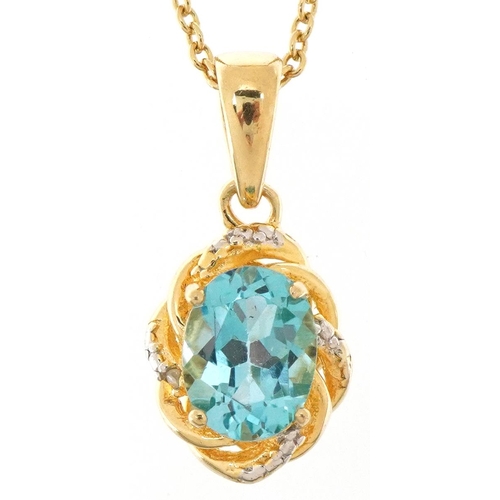 2085 - Silver gilt blue topaz and diamond pendant on a silver gilt necklace, 1.8cm high and 40cm in length,... 