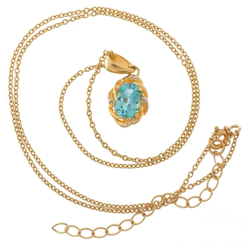 2085 - Silver gilt blue topaz and diamond pendant on a silver gilt necklace, 1.8cm high and 40cm in length,... 