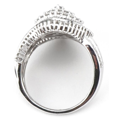 2040 - 9ct white gold diamond cocktail ring set with round brilliant cut and baguette cut diamonds, total d... 