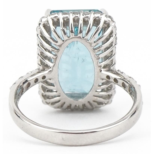 2064 - Large platinum emerald cut aquamarine and diamond ring with diamond set shoulders, the aquamarine ap... 