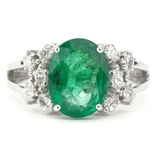 18ct white gold oval emerald and marquise cut diamond cluster ring, the ...