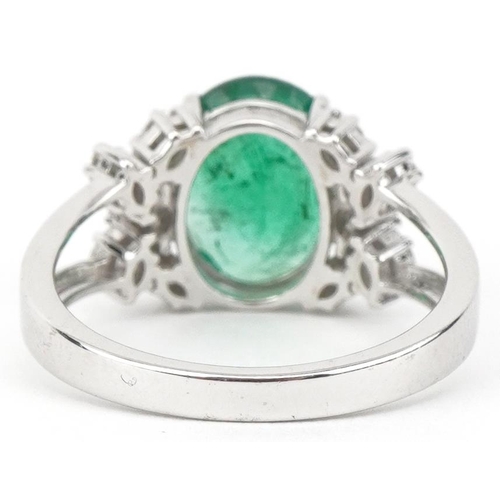 2186 - 18ct white gold oval emerald and marquise cut diamond cluster ring, the emerald approximately 2.52 c... 