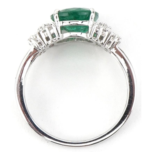 2186 - 18ct white gold oval emerald and marquise cut diamond cluster ring, the emerald approximately 2.52 c... 