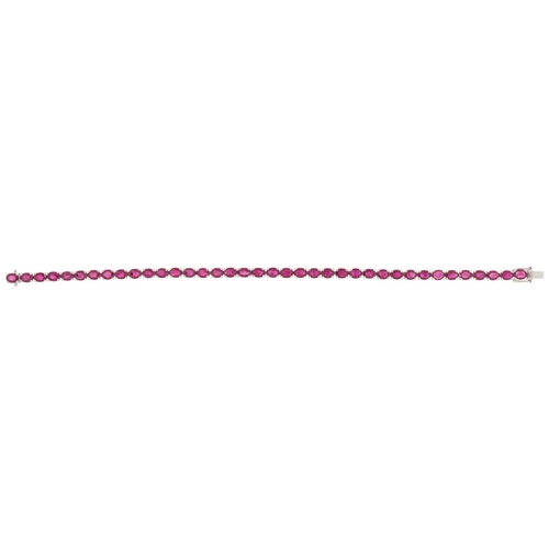 2081 - 18ct white gold oval ruby line bracelet, total ruby weight approximately 10.28 carat, 18cm in length... 