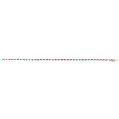 2081 - 18ct white gold oval ruby line bracelet, total ruby weight approximately 10.28 carat, 18cm in length... 