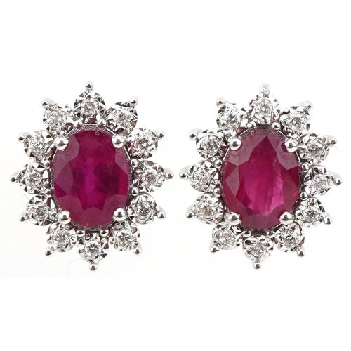 2098 - Pair of 18ct white gold ruby and round brilliant cut diamond cluster stud earrings, total diamond we... 