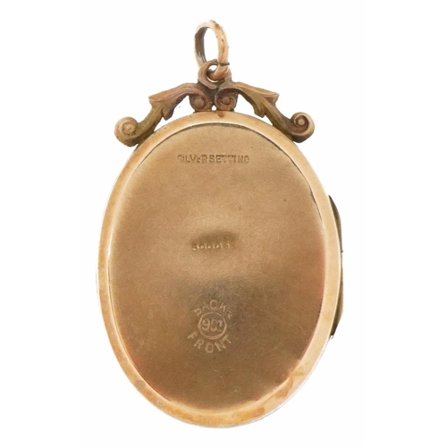 2100 - 9ct gold back and front locket with engraved lyre set with clear stones, 3cm high, 6.0g