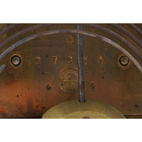 229 - 19th century carved mahogany mantle clock striking on a gong with silvered dial engraved with foliag... 