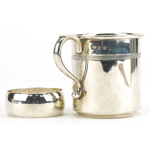 294 - Continental 935 grade silver christening tankard and a white metal napkin ring, the tankard 6.5cm hi... 