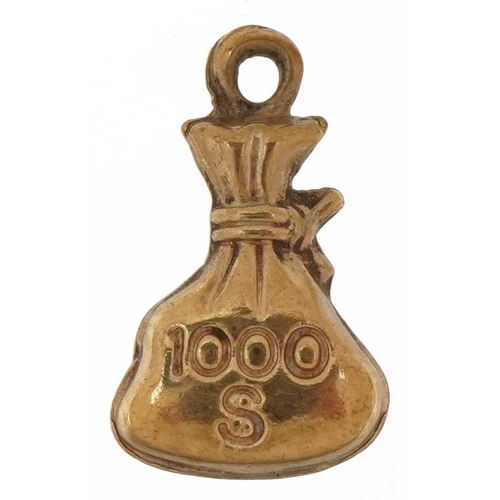 2617 - Unmarked gold one thousand dollar money sack charm, tests as 9ct gold, 1.5cm high, 0.5g