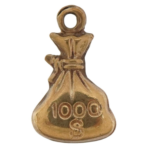 2617 - Unmarked gold one thousand dollar money sack charm, tests as 9ct gold, 1.5cm high, 0.5g