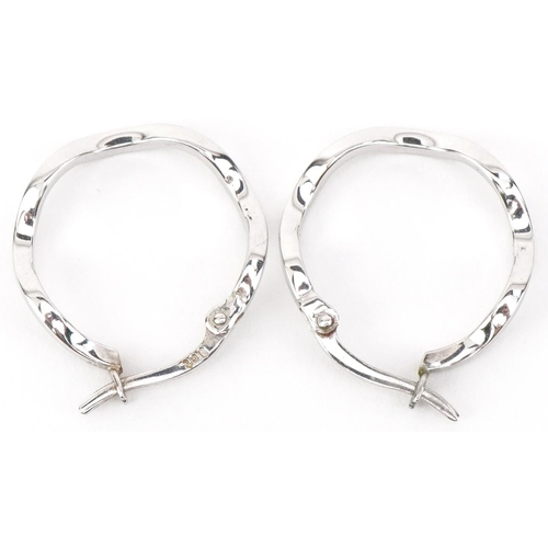 2673 - Pair of 9ct white gold hoop earrings, 1.8cm in diameter, 1.1g