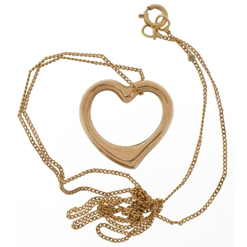 2028 - Unmarked gold love heart pendant on a 9ct gold necklace, the pendant tests as 9ct gold, 1.5cm high, ... 