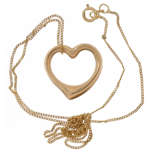 2028 - Unmarked gold love heart pendant on a 9ct gold necklace, the pendant tests as 9ct gold, 1.5cm high, ... 