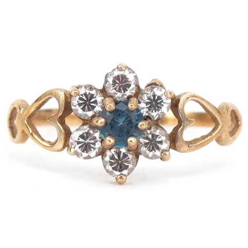 2184 - 9ct gold cubic zirconia and blue stone flower head ring with pierced love heart shoulders, size N, 1... 