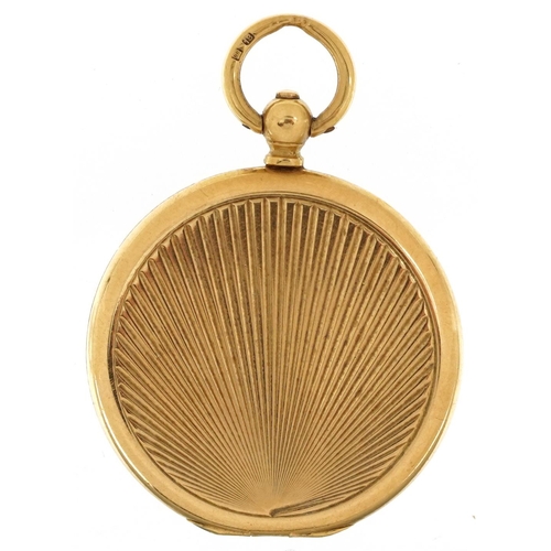 2113 - 18ct gold engine turned locket housing a flint arrow head, 3.3cm high, 10.0g