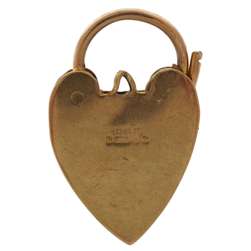 2183 - 9ct gold floral engraved love heart padlock, 2.6cm high, 3.5g