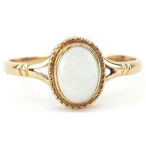 2580 - 9ct gold cabochon opal ring with split shoulders, size R, 1.6g