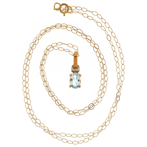 2798 - 9ct gold blue topaz solitaire pendant on a 9ct gold necklace, 1.4cm high and 44cm in length, 1.0g