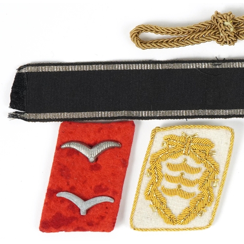 498 - German militaria including two breast eagle cloth badges