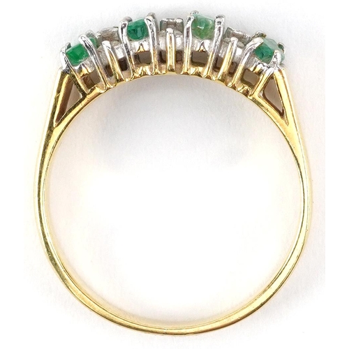 2018 - 18ct gold emerald and diamond ring set with nine diamonds, size O, 3.8g