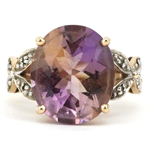 2075 - 9ct gold rainbow quartz solitaire ring with pierced diamond set shoulders, the quartz approximately ... 