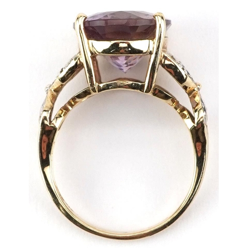 2075 - 9ct gold rainbow quartz solitaire ring with pierced diamond set shoulders, the quartz approximately ... 