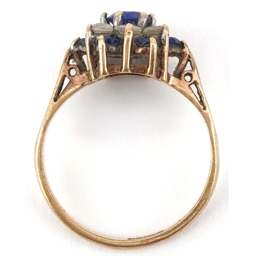 2777 - 9ct gold blue and white spinel three tier flower head ring, size K, 2.2g