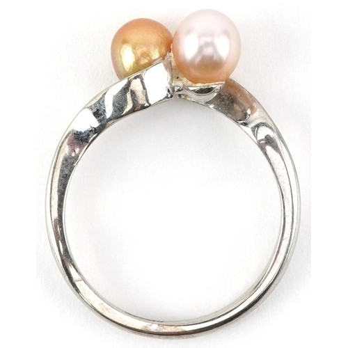 2740 - 9ct white gold cultured pearl crossover ring, size J/K, 1.9g