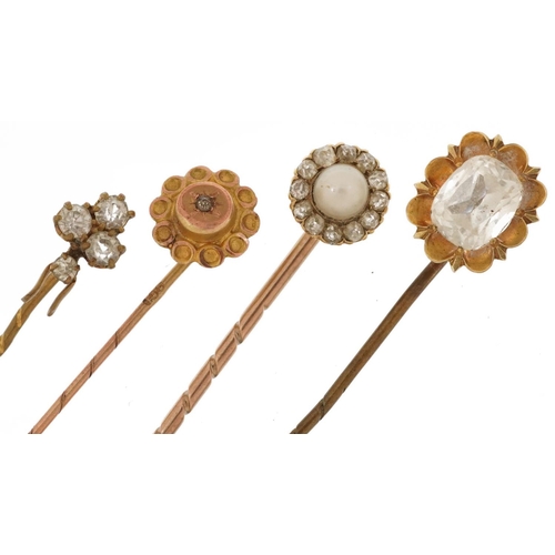 2165 - Four antique gold and yellow metal stickpins including one with cultured pearl and diamonds, the lar... 