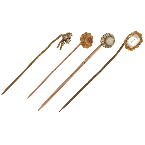 2165 - Four antique gold and yellow metal stickpins including one with cultured pearl and diamonds, the lar... 