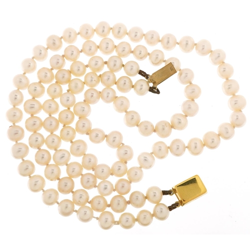 2803 - Cultured pearl two row necklace with 9ct gold clasp housed in an H Samuel fitted box, 38cm in length... 