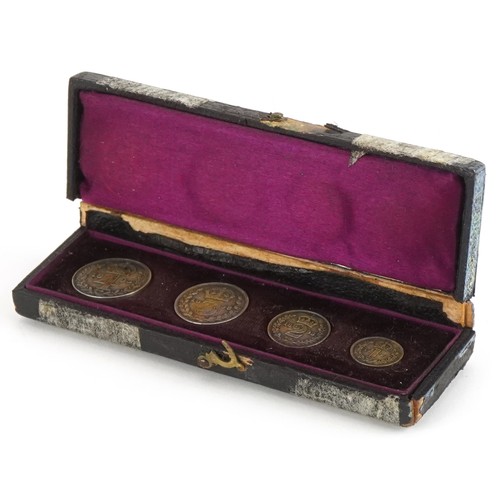 1411 - Queen Victoria 1893 Maundy four coin set housed in a fitted tooled leather case