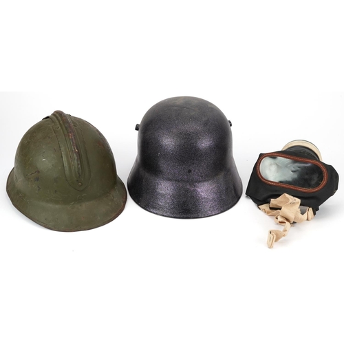 459A - Two military interest helmets and a gas mask with box