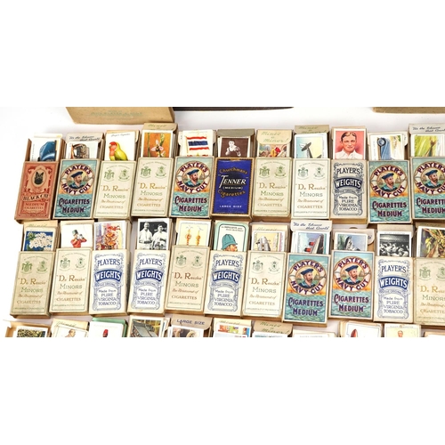 1499 - Large collection of cigarette cards, some arranged in albums, including motor cars and international... 