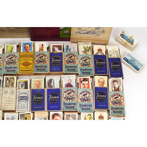 1499 - Large collection of cigarette cards, some arranged in albums, including motor cars and international... 