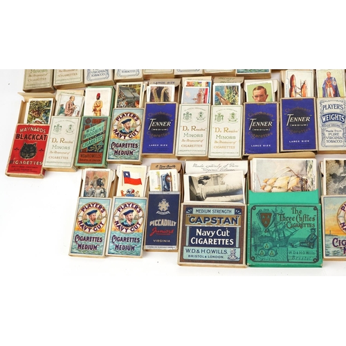 1499 - Large collection of cigarette cards, some arranged in albums, including motor cars and international... 