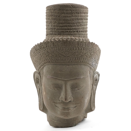 139 - Cambodian style carved stone head of a bearded man, 32cm high