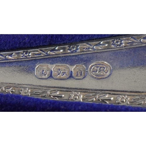 1131 - John Round & Son Ltd, Victorian silver fork and spoon christening set housed in a velvet and silk li... 